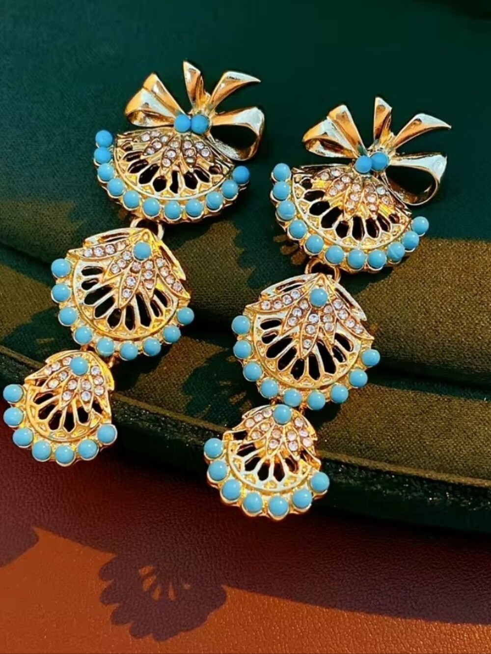 Beautiful Gold and Turquoise Dangle Earrings with Bow Accent